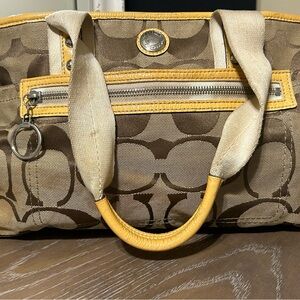 Tan and yellow coach